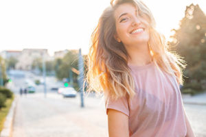 woman smiling, teeth cleaning cinco ranch tx, about lovett dental cinco ranch