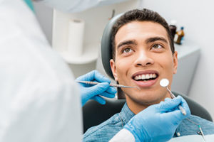 man getting dental treatment dental bonding cinco ranch tx