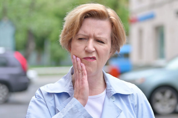 how does tooth decay develop woman in pain wondering how does tooth decay develop