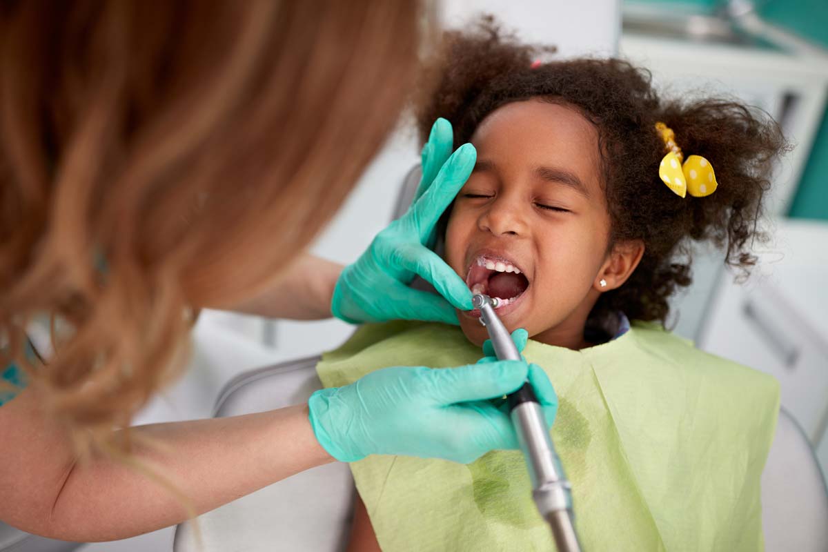 child getting pediatric dental emergency services