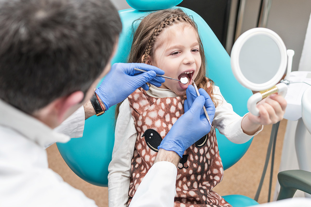 treating a chipped tooth (1) dentist treating a chipped tooth in a child