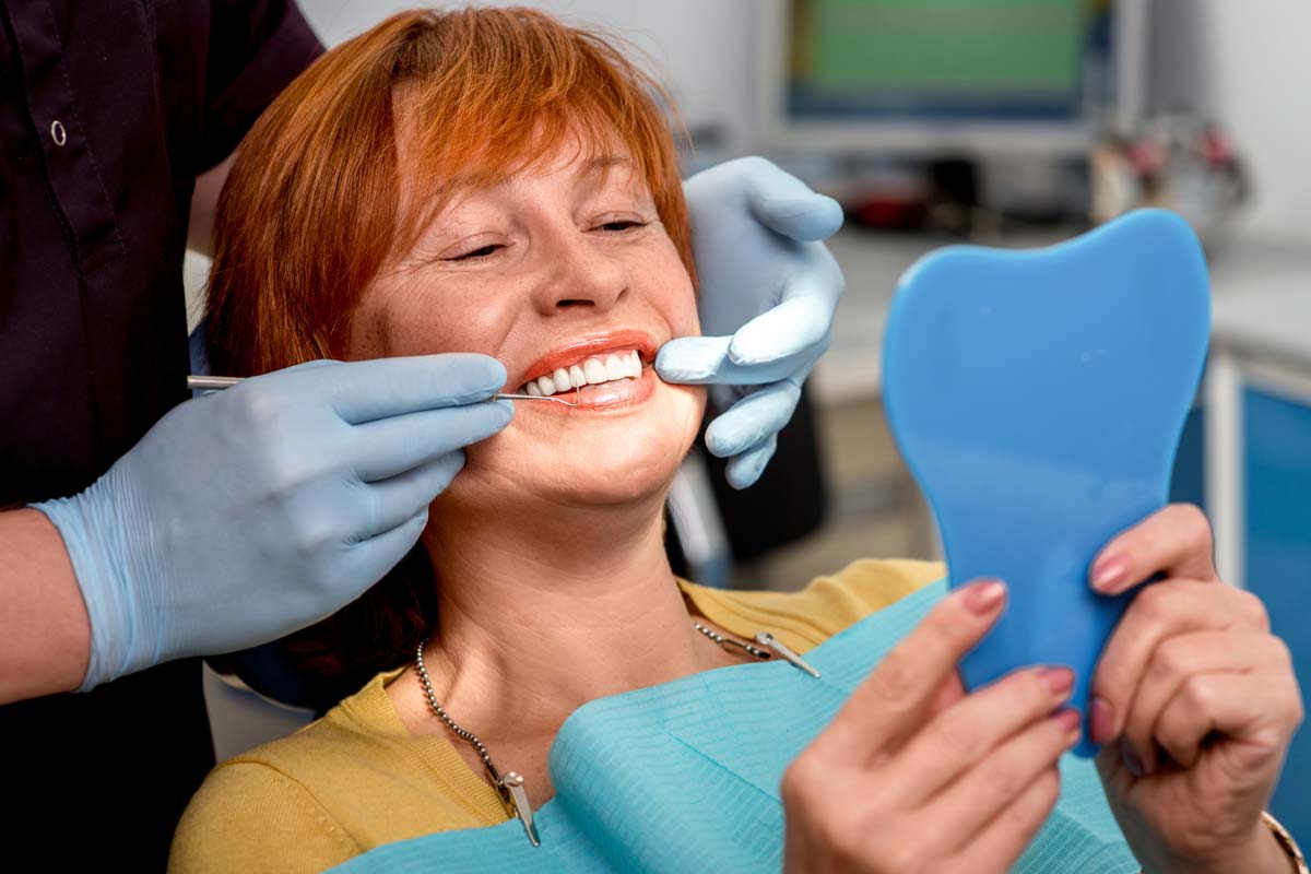 woman getting alternatives to dentures