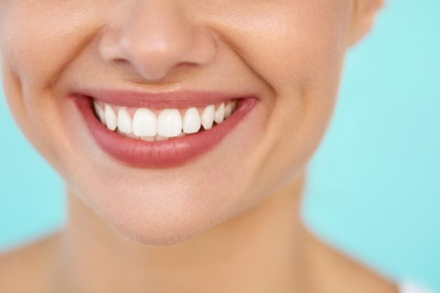full mouth rehabilitation patient smiling after full mouth rehabilitation