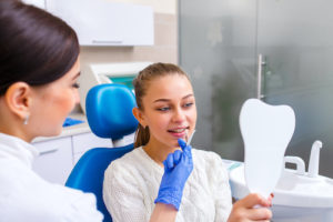 woman who needs dental crowns and bridges