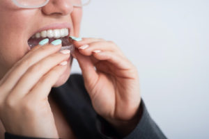 woman using nightguards for her teeth