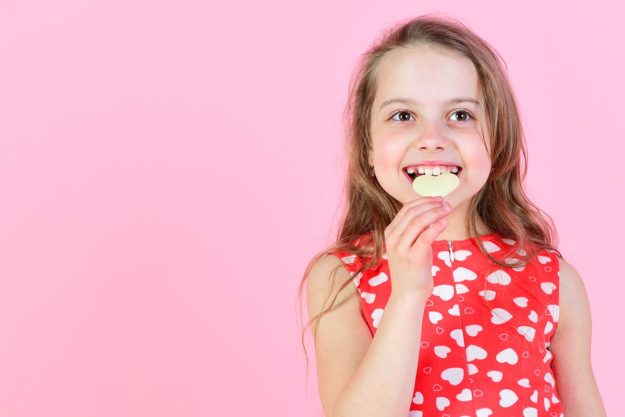 girl who is thinking about sugar and your dental health