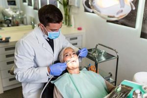 an emergency dentist works on a patient