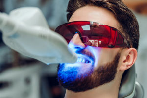 man undergoing teeth whitening 