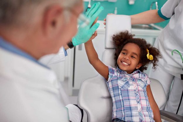 How to Choose a Pediatric Dental Office young girls parents chose a pediatric dental office