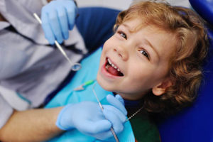 kid receiving pediatric dentistry services 